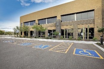 An accessible car park outside a building.
