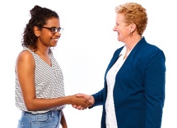 Two women shaking hands. 